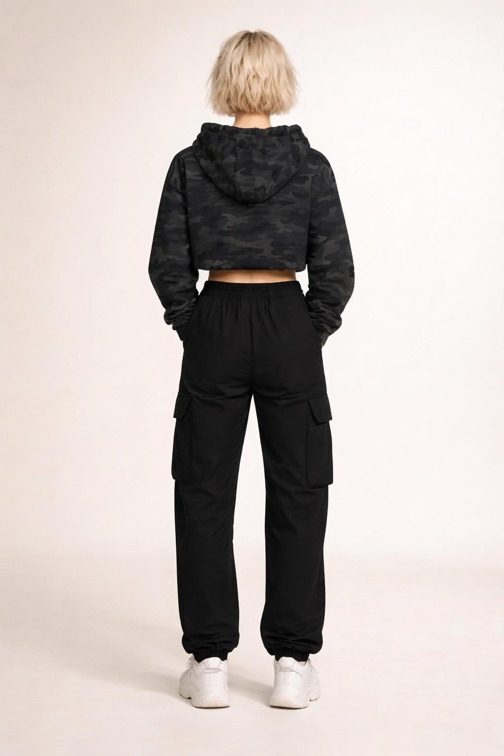 Back pose of the model wearing Tovolea Ladies Black Camo Cropped Hooded Sweatshirt