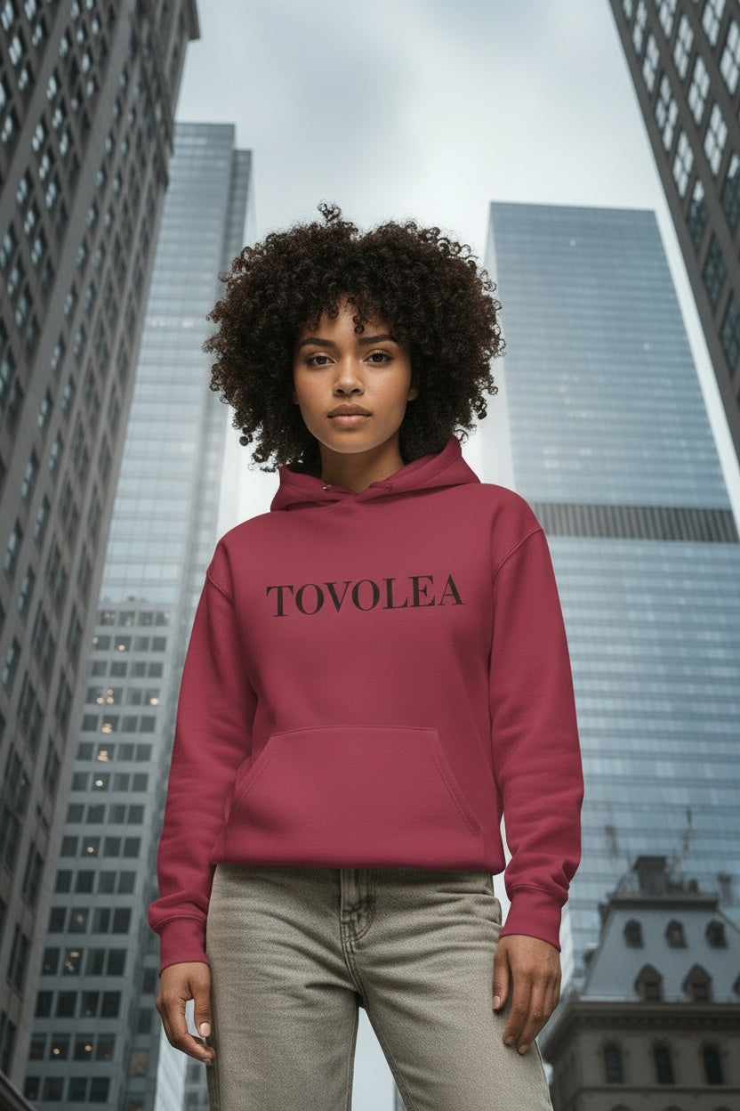 Close-up of the model wearing Tovolea Crimson Cozy Pullover