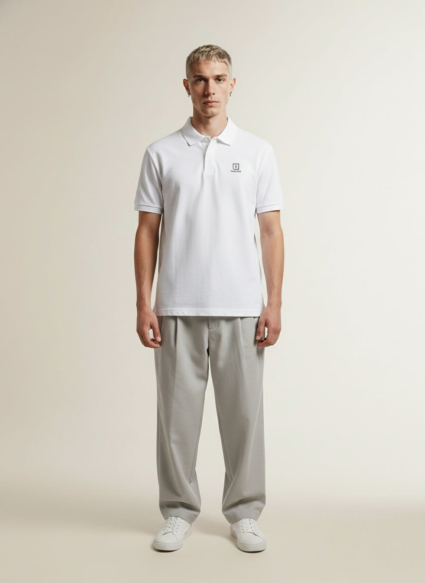 Full body view of the model wearing Tovolea Gents White Polo Shirt