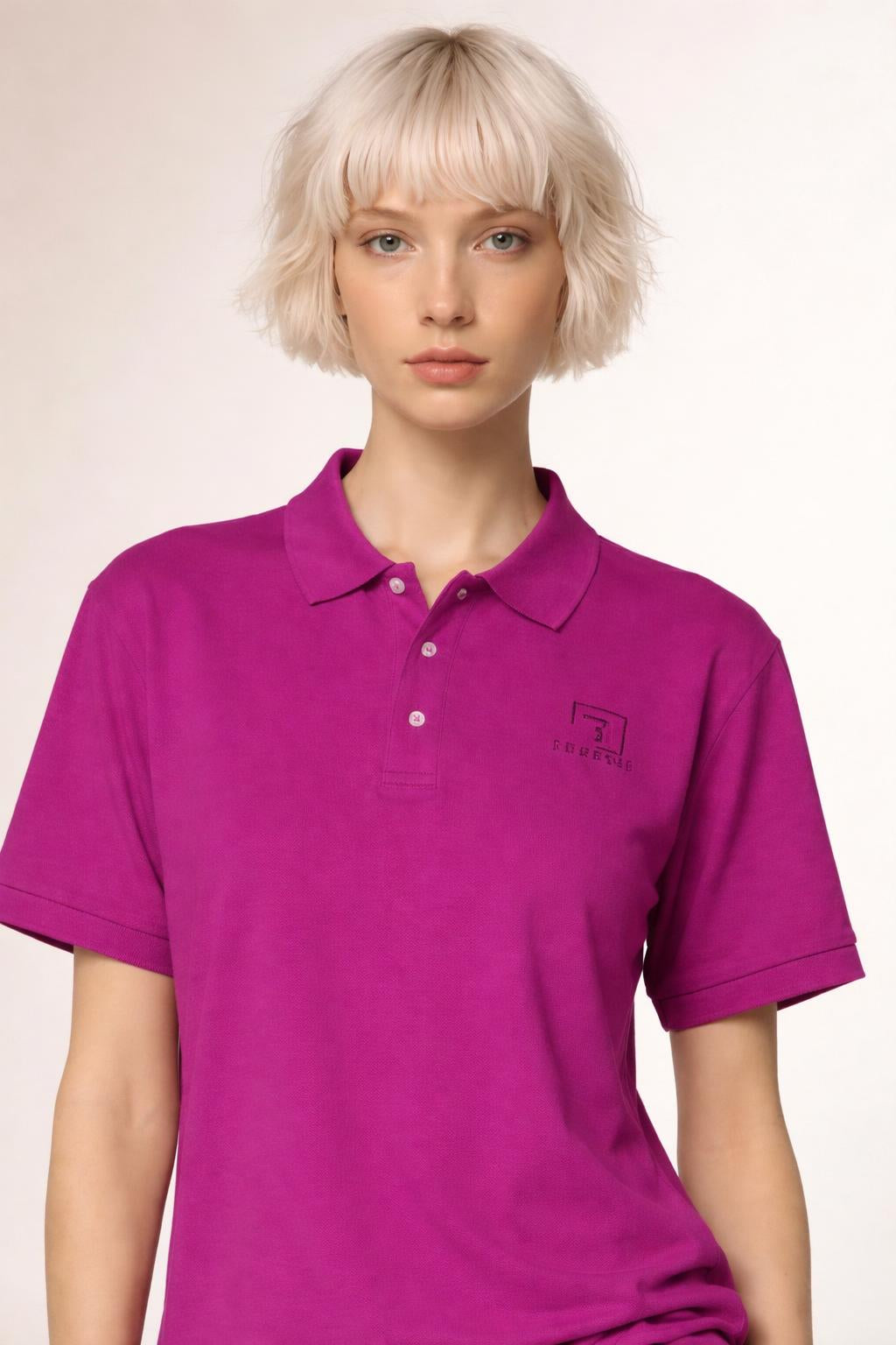 Close-up of the model wearing Tovolea Ladies Pink Polo Shirt