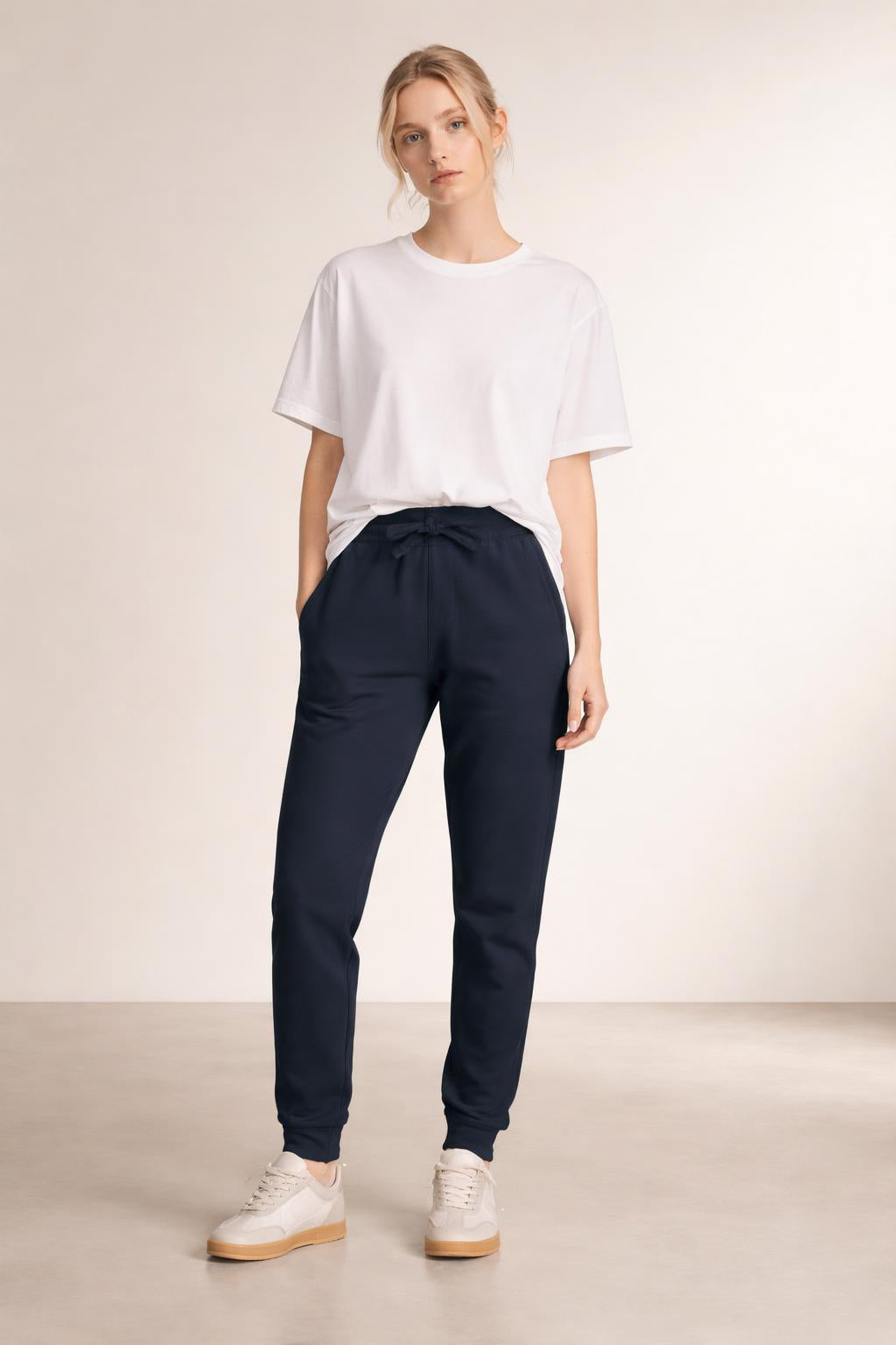Full body view of the model wearing Tovolea Embroidered Navy Blue Fleece Sweatpants
