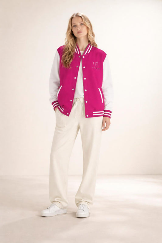 Full body view of the model wearing Tovolea Ladies Classic Pink & White Letterman Jacket