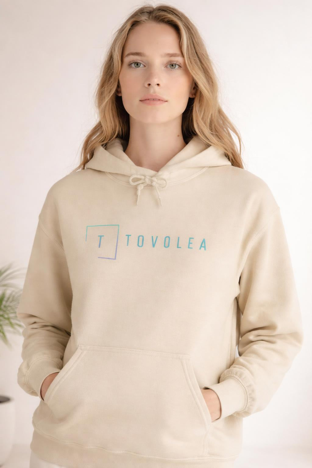 Close-up of the model wearing Tovolea Ladies Ivory Lightweight Hoodie