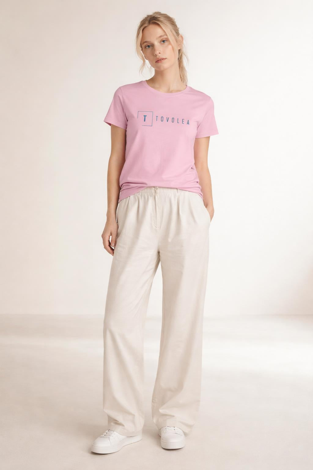 Full body view of the model wearing Tovolea Women's Pink Light T-Shirt