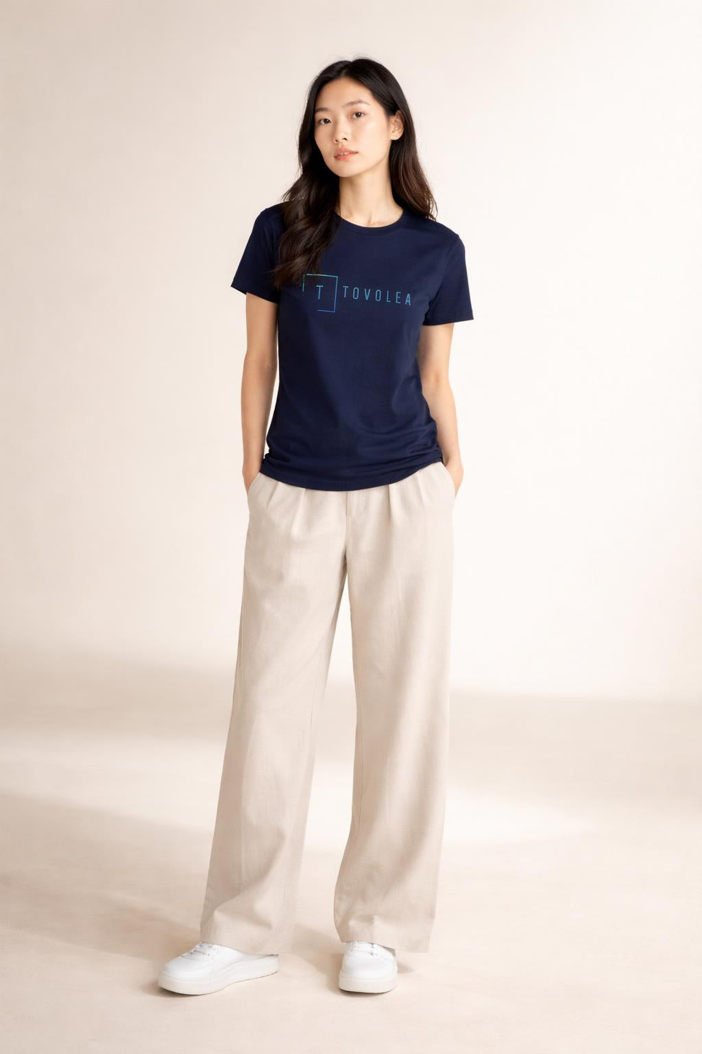 Full body view of the model wearing Tovolea Women's Navy Blue Light T-Shirt