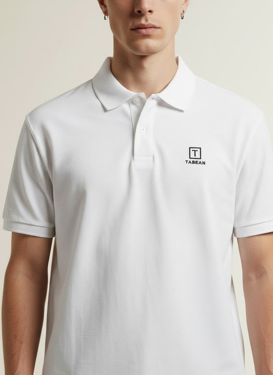Close-up of the model wearing Tovolea Gents White Polo Shirt