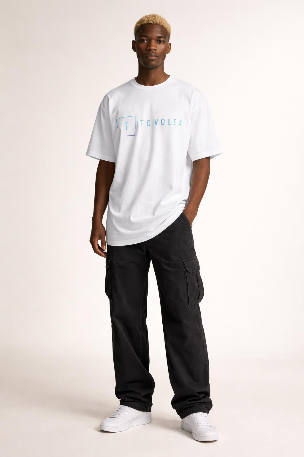 Full body view of the model wearing Tovolea Men’s White Light T-Shirt