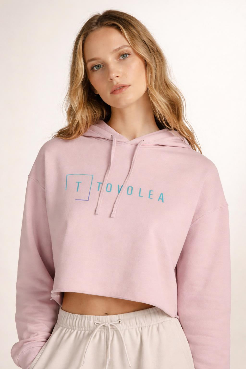 Close-up of the model wearing Tovolea Women’s Blush Cropped Hooded Sweatshirt
