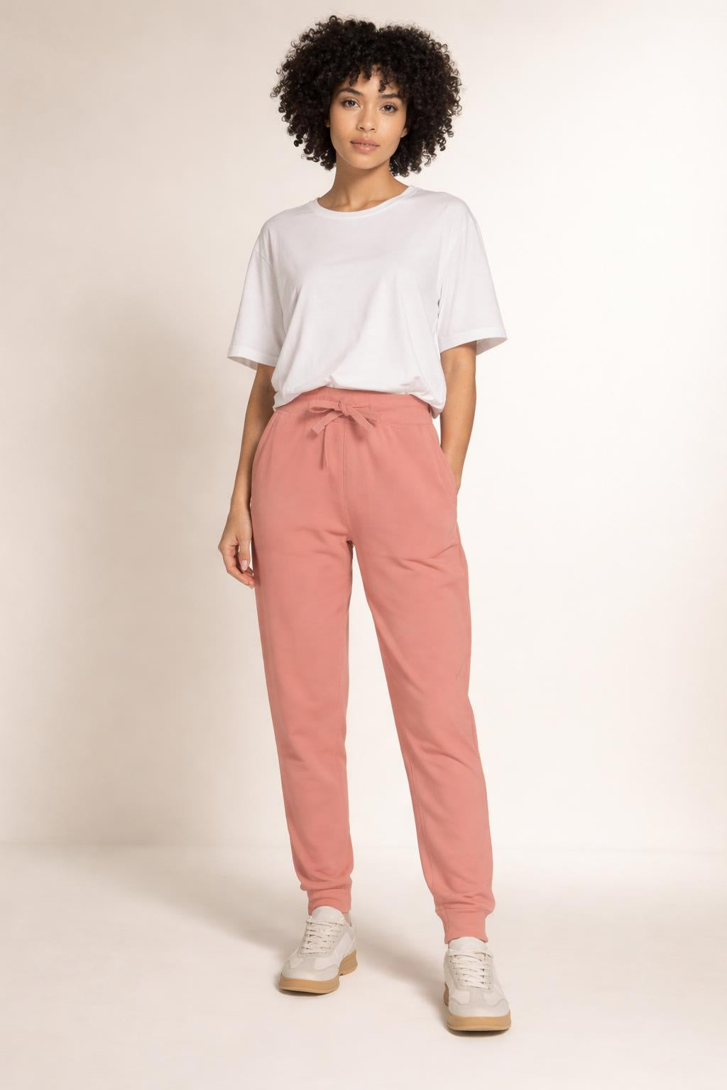 Full body view of the model wearing Tovolea Embroidered Dusty Rose Fleece Sweatpants