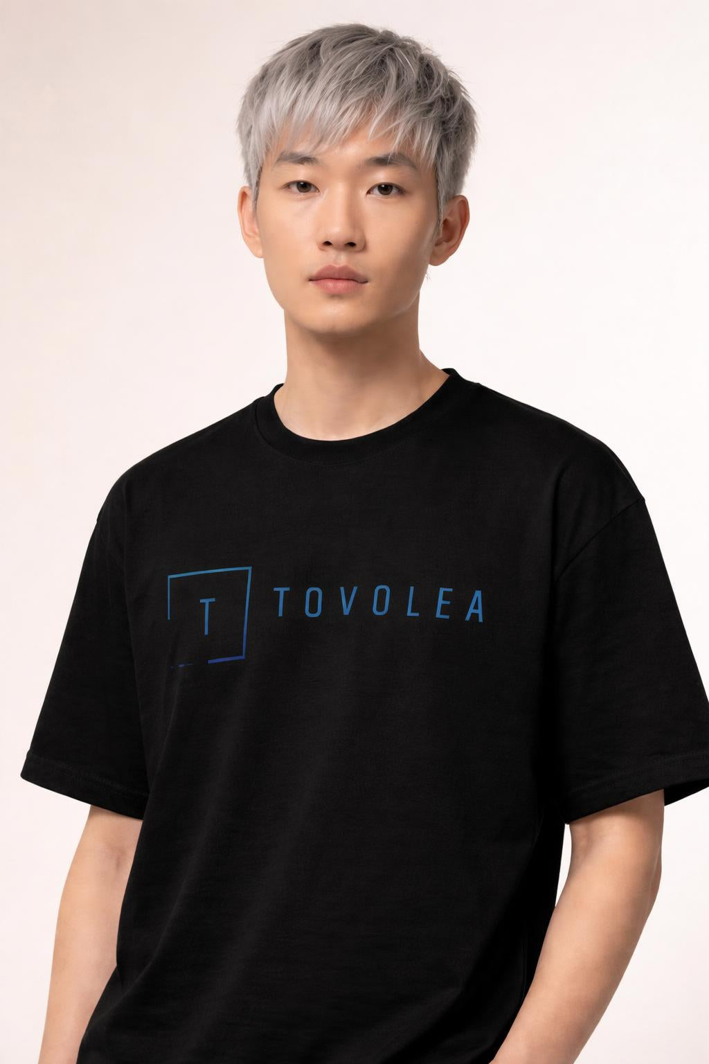Close-up of the model wearing Tovolea Men’s Black Light T-Shirt