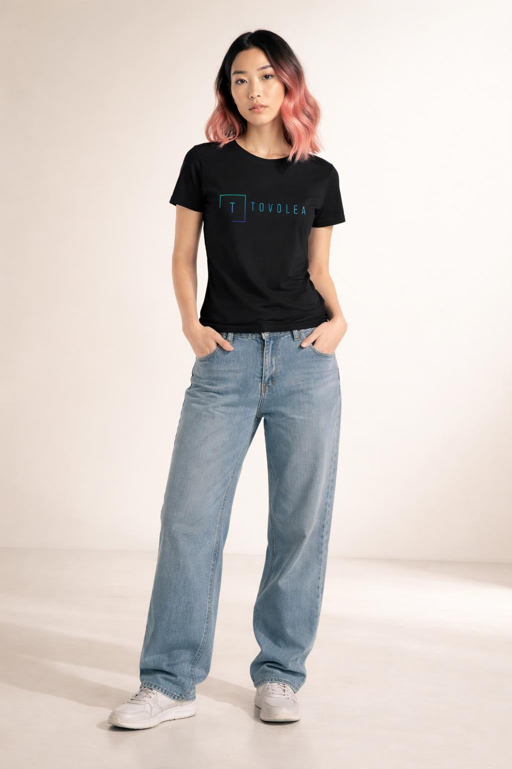 Full body view of the model wearing Tovolea Women's Black Light T-Shirt