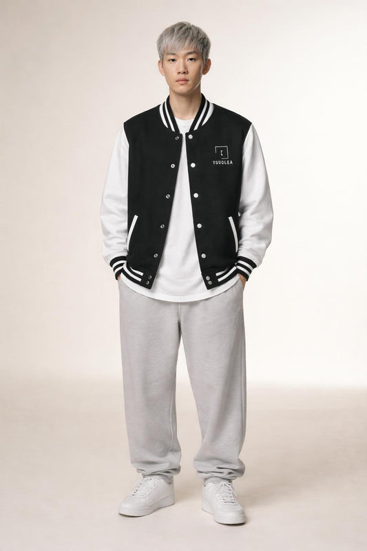 Full body view of the model wearing Tovolea Gents Classic Black & White Letterman Jacket
