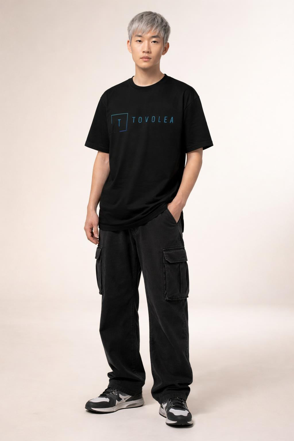 Full body view of the model wearing Tovolea Men’s Black Light T-Shirt