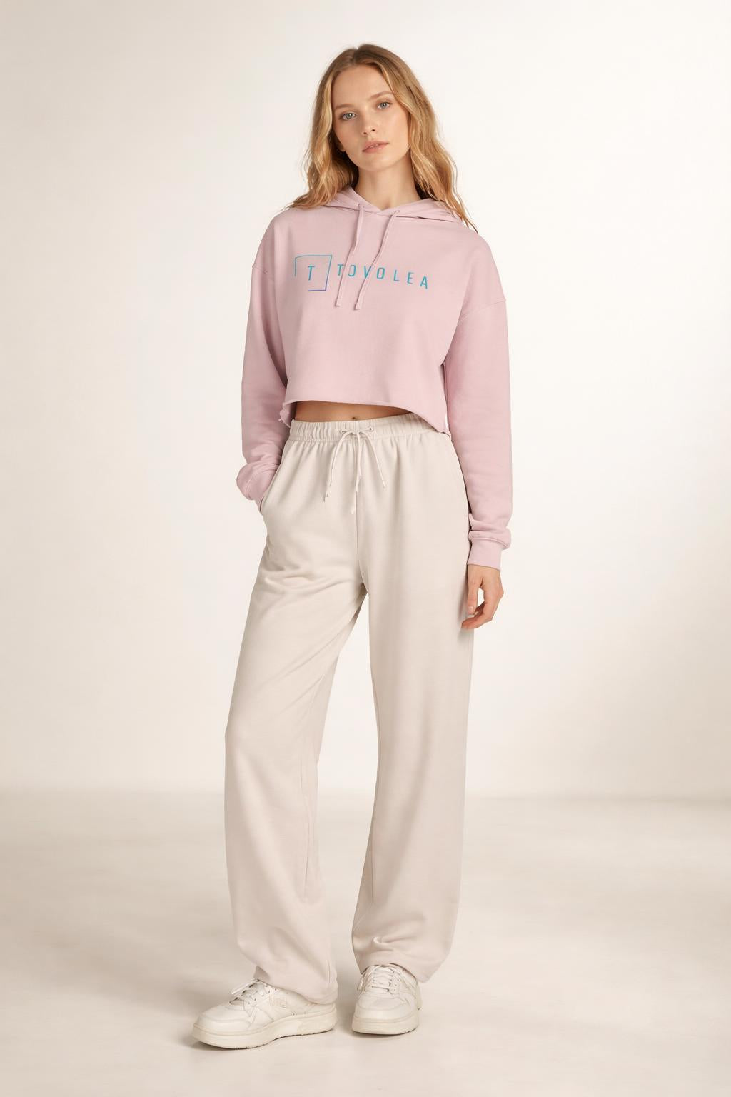 Full body view of the model wearing Tovolea Women’s Blush Cropped Hooded Sweatshirt