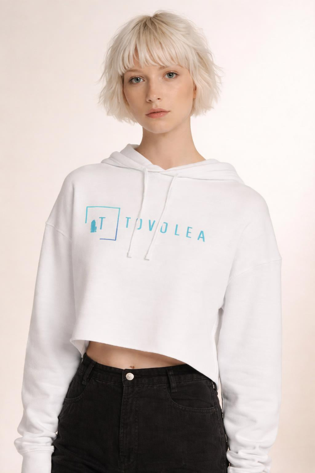 Close-up of the model wearing Tovolea Women’s White Cropped Hooded Sweatshirt