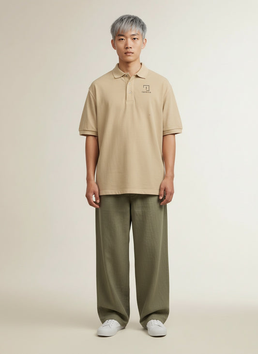 Full body view of the model wearing Tovolea Gents Beige Polo Shirt