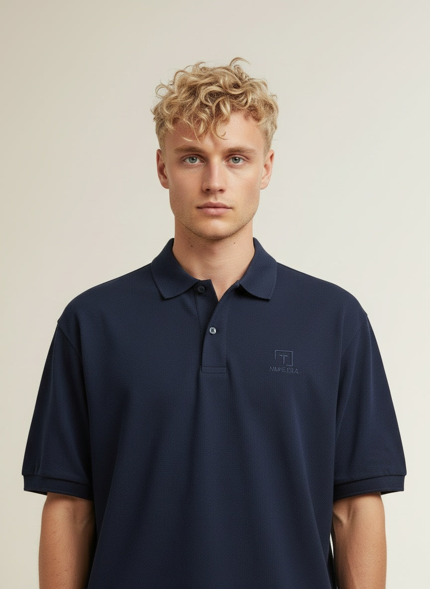Close-up of the model wearing Tovolea Gents Navy Blue Polo Shirt