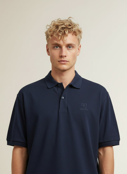 Close-up of the model wearing Tovolea Gents Navy Blue Polo Shirt