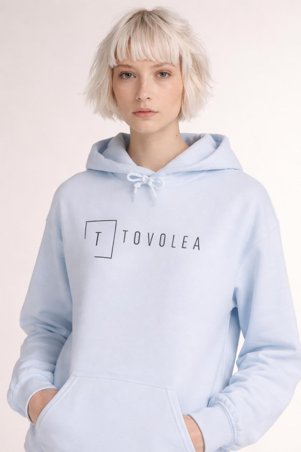 Close-up of the model wearing Tovolea Ladies Light Blue Lightweight Hoodie