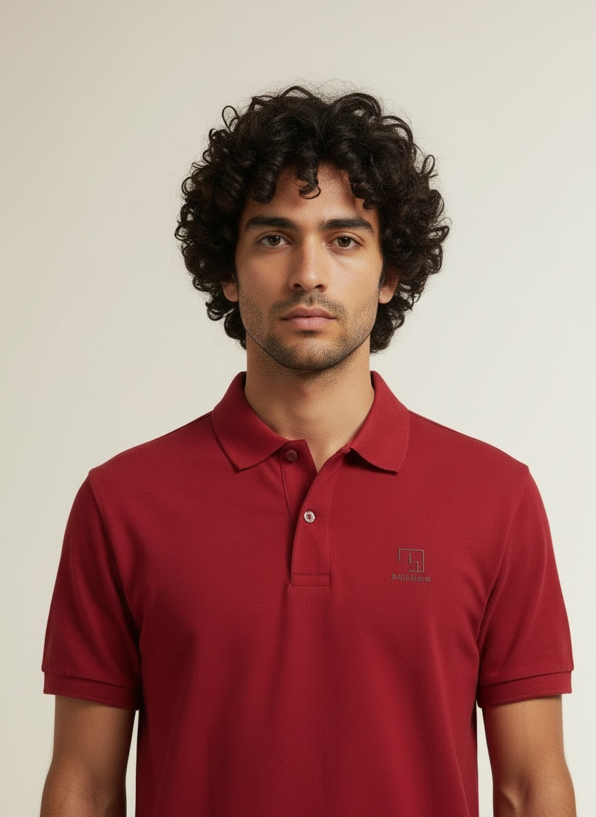 Close-up of the model wearing Tovolea Gents Red Polo Shirt