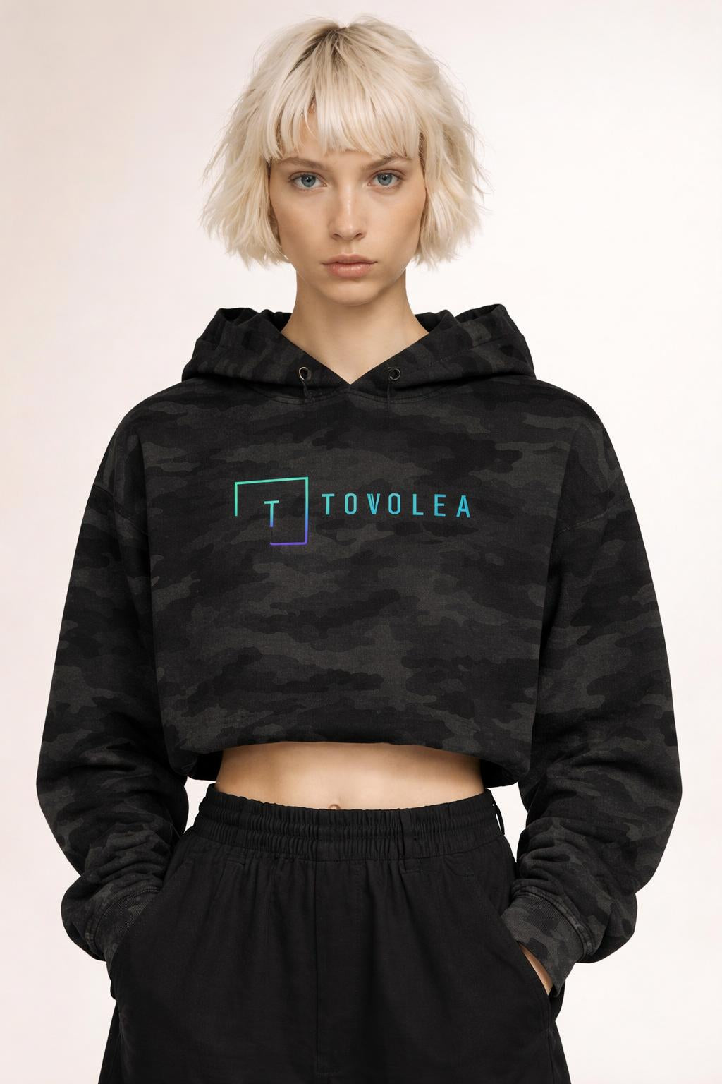 Close-up of the model wearing Tovolea Ladies Black Camo Cropped Hooded Sweatshirt