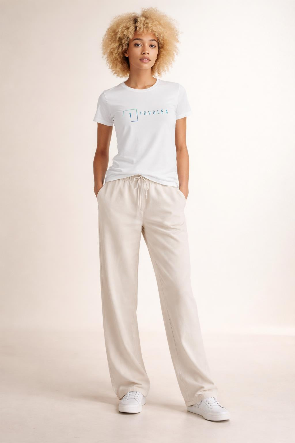 Full body view of the model wearing Tovolea Women's White Light T-Shirt
