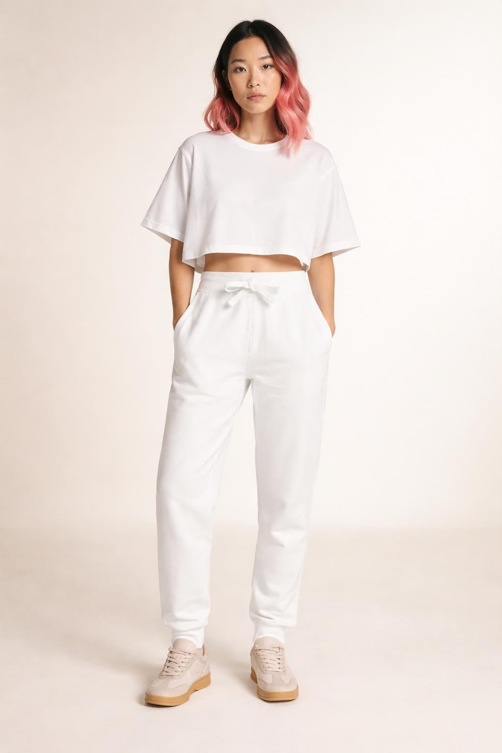 Full body view of the model wearing Tovolea Embroidered White Fleece Sweatpants