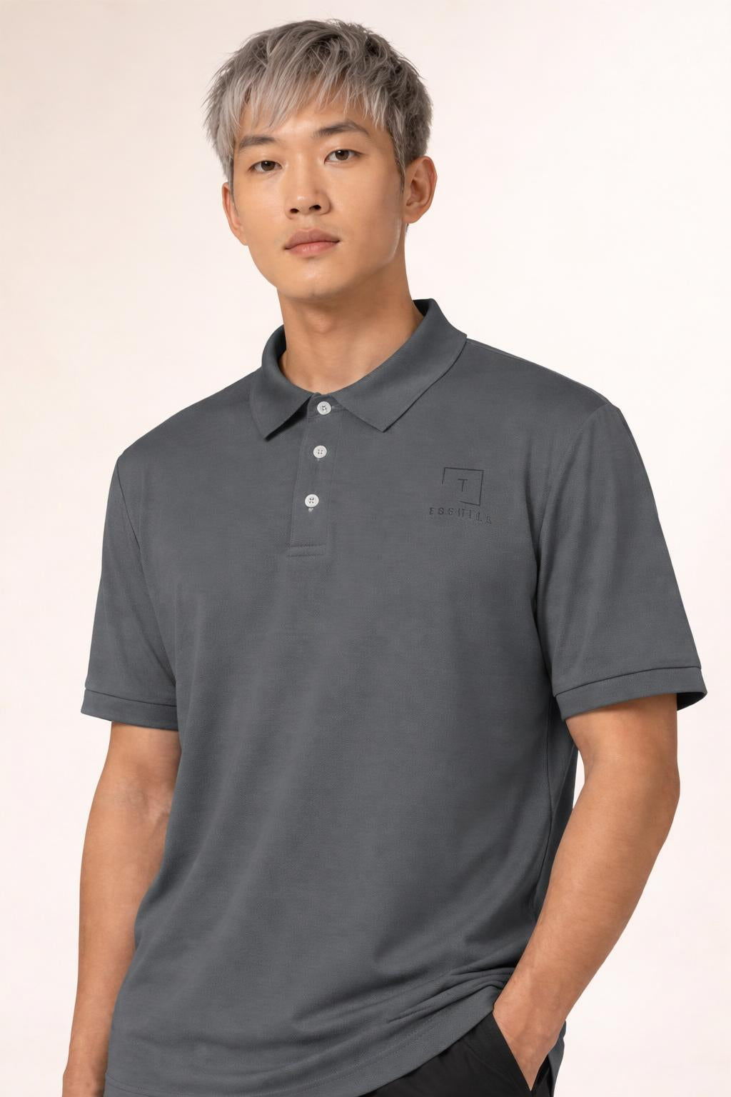 Close-up of the model wearing Tovolea Gents Dark Grey Polo Shirt