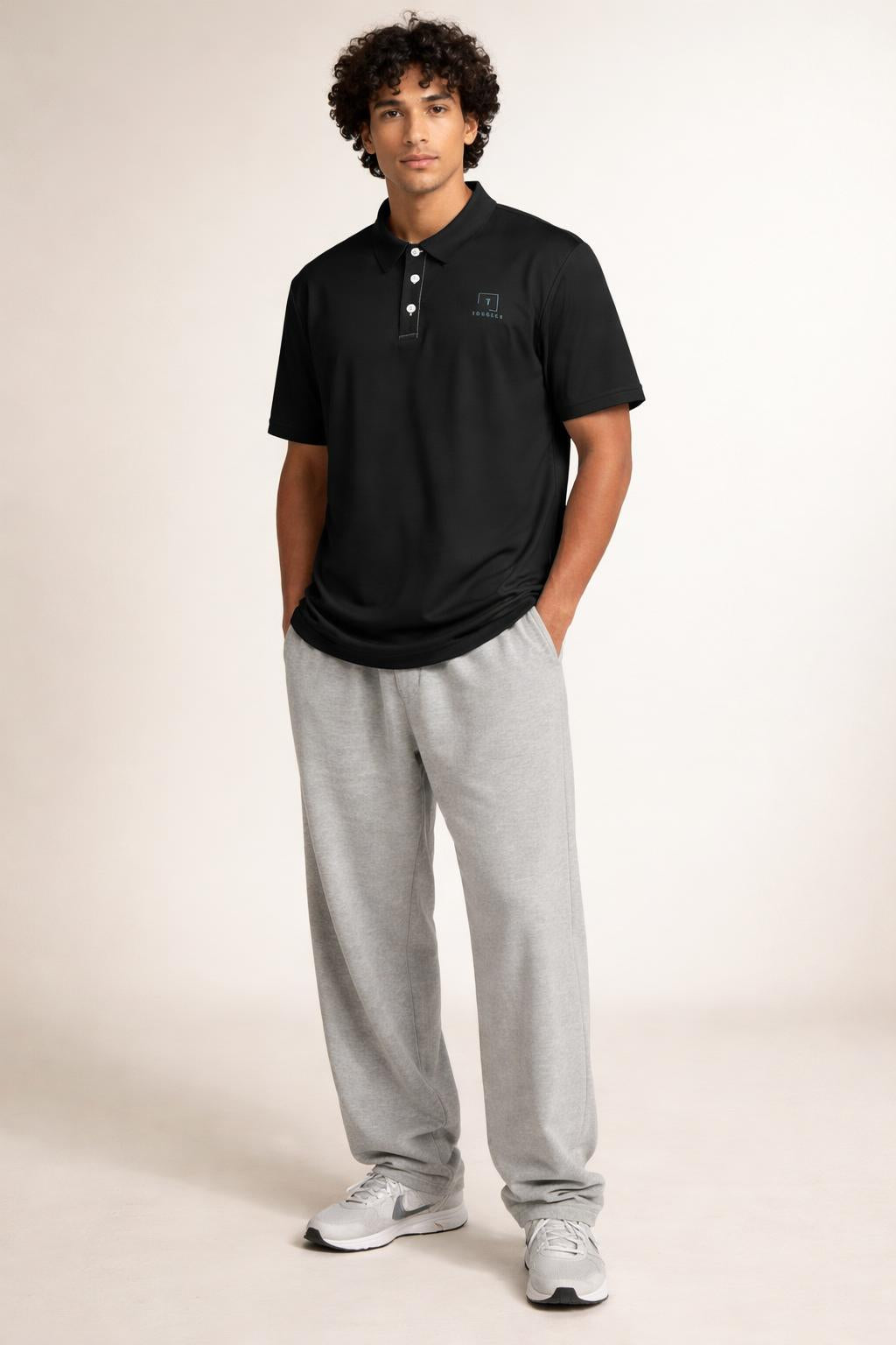 Full body view of the model wearing Tovolea Gents Black Polo Shirt